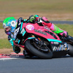 Biker racing around a sharp corner on track