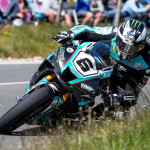 Sports bike cutting through a corner at speed