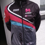 Another team member wearing team jacket