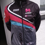 Another team member wearing team jacket